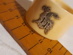 Antique Edwardian bovine bone napkin ring with silver plated initials could be A
