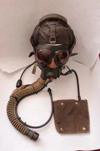 Korean War MIG15 pilot leather helmet, oxygen mask, and goggles