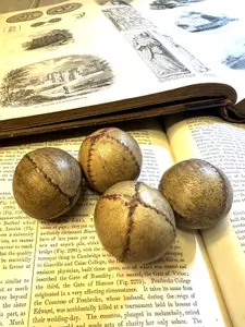 Antique 19th century leather stitched feather stuffed balls.